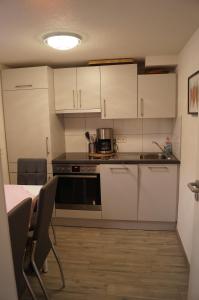 Kuchyň nebo kuchyňský kout v ubytování Traumhafte Ferienwohnung mit Pool