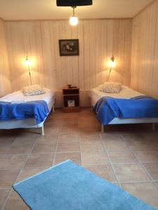 Postel nebo postele na pokoji v ubytování skummeslöv B & B