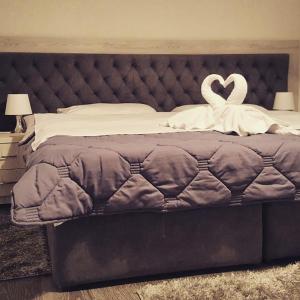 Postel nebo postele na pokoji v ubytování Hotel Livia