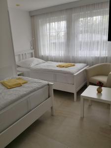 Postel nebo postele na pokoji v ubytování Hotel Milan Vopicka