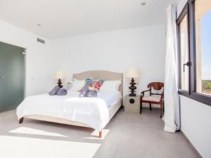 Ein Bett oder Betten in einem Zimmer der Unterkunft Villa Can Paulo