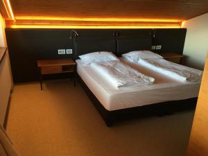 Postel nebo postele na pokoji v ubytování Hotel Ansitz Kematen ***S