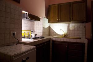 a small kitchen with a sink and a stove at Agriturismo San Fedele in Perugia