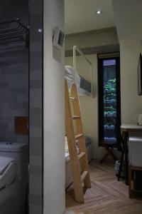 Voodi või voodid majutusasutuse NiHao Café Hotel toas