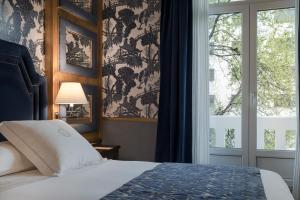 Llit o llits en una habitació de Relais & Châteaux Heritage Hotel
