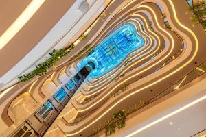 an overhead view of a building with a swimming pool at Gulf Inn Hotel Al Nasr Formerly Roda Links Al Nasr in Dubai