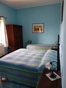 Posteľ alebo postele v izbe v ubytovaní Agriturismo San Fedele