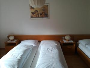 Postel nebo postele na pokoji v ubytování Bigraberhof