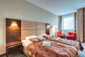 Posteľ alebo postele v izbe v ubytovaní Apartamenty Diva Kołobrzeg