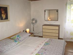Postel nebo postele na pokoji v ubytování Apartment Sveti Jakov 37