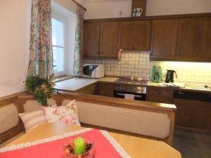 a kitchen with a table with a bowl on top of it at Ferienwohnung Resi im Zentrum in Fusch an der Glocknerstraße