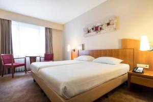 Postel nebo postele na pokoji v ubytování Astoria Hotel Antwerp