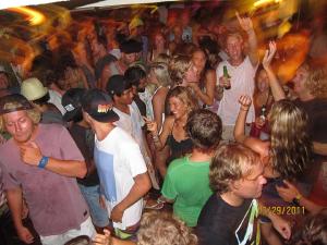 a crowd of people dancing in a party at Jordan Guest House in Uluwatu