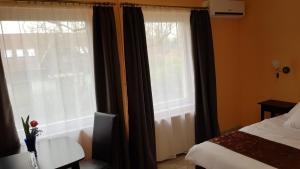 Posteľ alebo postele v izbe v ubytovaní Joy Guesthouse