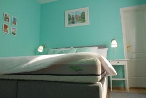 Posteľ alebo postele v izbe v ubytovaní Joy Guesthouse