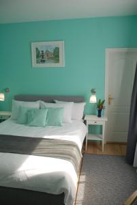 Posteľ alebo postele v izbe v ubytovaní Joy Guesthouse