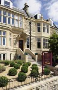 a building with a staircase in front of it at Brooks Guesthouse in Bath