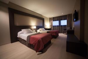 Postel nebo postele na pokoji v ubytování Brea's Hotel + 37 fotografií