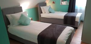 Posteľ alebo postele v izbe v ubytovaní Joy Guesthouse