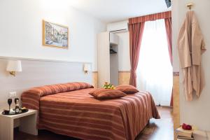 Uma cama ou camas num quarto em Domus Giulia