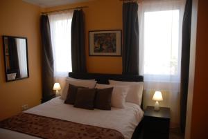 Posteľ alebo postele v izbe v ubytovaní Joy Guesthouse