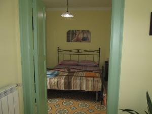 Posteľ alebo postele v izbe v ubytovaní Casa e Putia