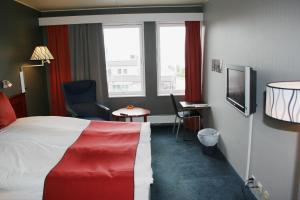 Postel nebo postele na pokoji v ubytování F2 Hotel
