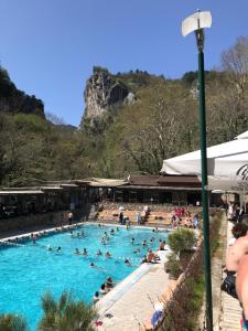 a group of people in a swimming pool at Villa Paradisos in Likóstomon
