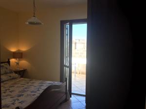 Posteľ alebo postele v izbe v ubytovaní Favignana Margot House
