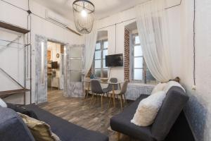 a living room with a couch and a table at New&Old in Tbilisi City