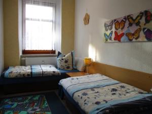 Postel nebo postele na pokoji v ubytování Ferienwohnung Alte Apotheke