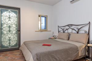 Letto o letti in una camera di Hotel Vello d'Oro
