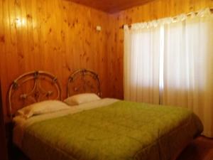 Ein Bett oder Betten in einem Zimmer der Unterkunft Cabañas de Campo Colbún