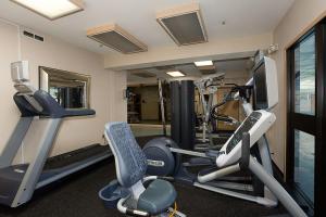a gym with two tread machines and a television at Shilo Inn Portland Airport in Portland