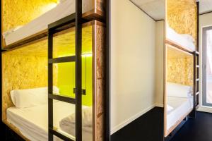 a bedroom with a bed and a window at Bastardo Hostel in Madrid