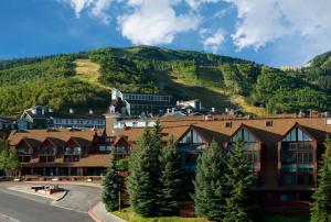 a town with a mountain in the background at The Lodge at the Mountain Village by All Seasons Resort Lodging in Park City