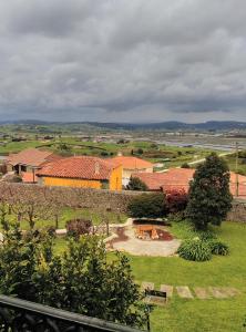 a view of a farm with a group of buildings at Posada Campo in Suances