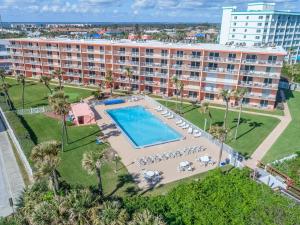 an aerial view of a resort with a swimming pool at Cocoa Beach Towers in Cocoa Beach