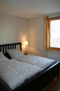 a bedroom with two beds and a window at Auf dem Berg in Malchow