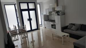 a living room with a couch and a table at Apartamento Juli4 in Puerto de las Nieves
