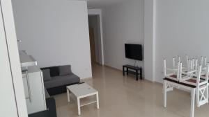 TV a/nebo společenská místnost v ubytování Apartamento Juli4