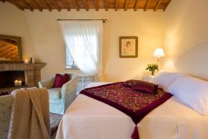 A bed or beds in a room at Villa San Sanino - Relais in Tuscany