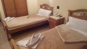 Voodi või voodid majutusasutuse Applicators Hotel toas