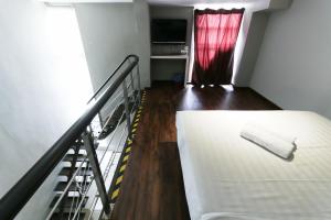 Ένα ή περισσότερα κρεβάτια σε δωμάτιο στο Hotel 99 Botanik Klang