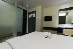 Voodi või voodid majutusasutuse Hotel 99 Bandar Klang (Meru) toas