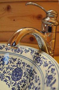 a sink with a faucet on top of it at Los Gatos Bed & Breakfast in Penn Yan