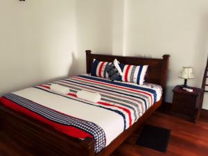 Postel nebo postele na pokoji v ubytování Himawari Beach Villa