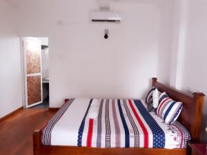Postel nebo postele na pokoji v ubytování Himawari Beach Villa