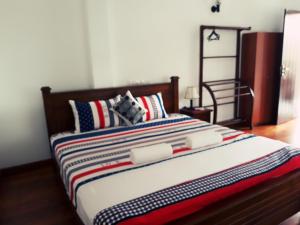 Postel nebo postele na pokoji v ubytování Himawari Beach Villa