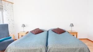 Postel nebo postele na pokoji v ubytování Hotelli Pikku-Syöte